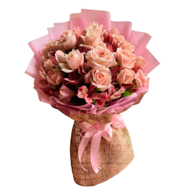 18 large-budded local pink roses accented with charming filler flowers
