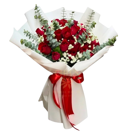Abundant Red Roses bouquet with imported accents