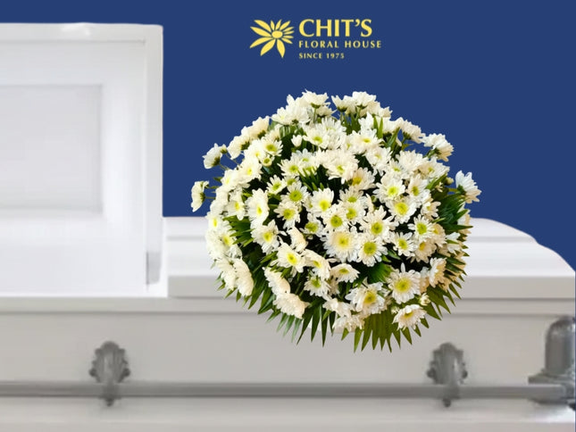 Cloud of Comfort funeral casket flower arrangement with white chrysanthemums and mums by Chits Floral House