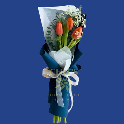 Fresh tulip arrangement with three stems