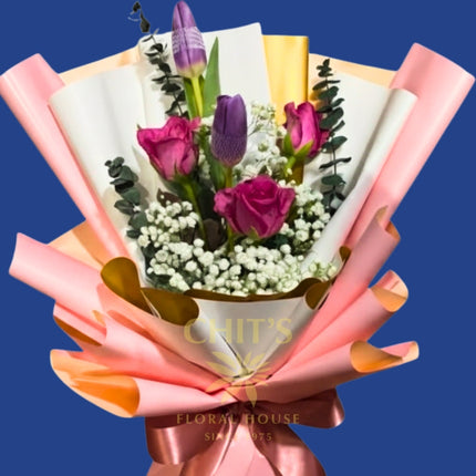 Fresh tulip and rose flower arrangement