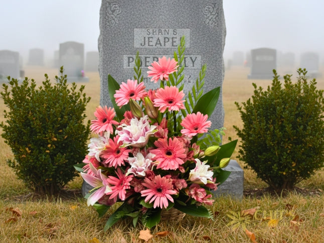 Condolence flower basket with gerbera, stargazer lilies, and mums