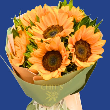 Half-Dozen Radiance six-stem sunflower bouquet with green leaves