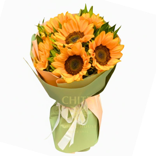 Half-Dozen Radiance six-stem sunflower bouquet with green leaves