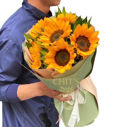 Half-Dozen Radiance six-stem sunflower bouquet with green leaves