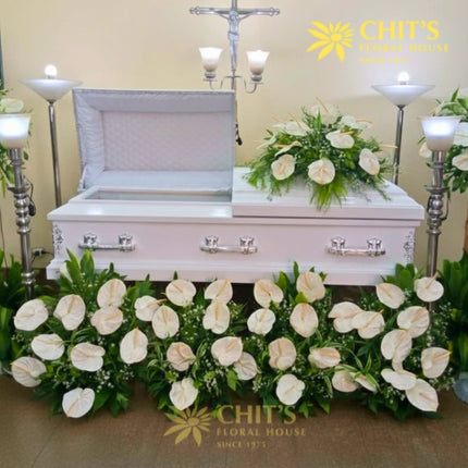 Heartfelt casket tribute package with full funeral floral setup