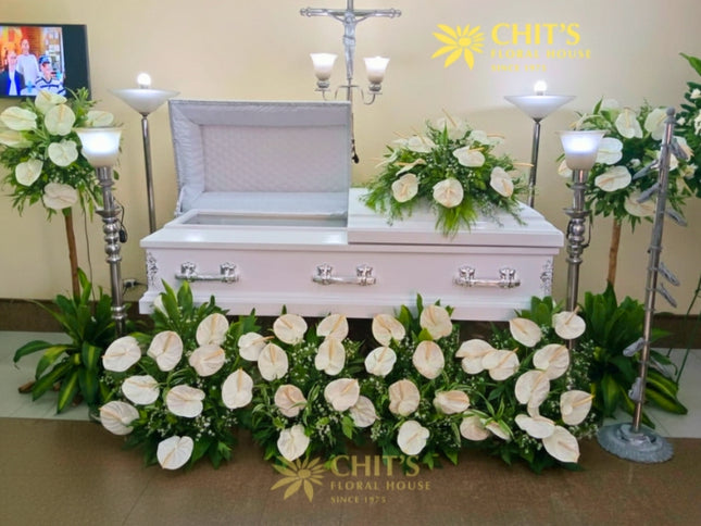 Heartfelt casket tribute package with full funeral floral setup