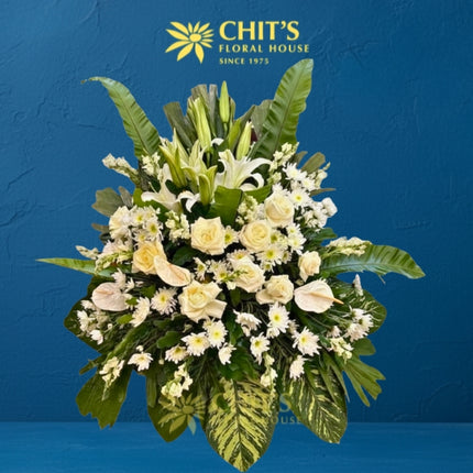 Heavenly Ascent funeral flower arrangement with white lilies and anthuriums