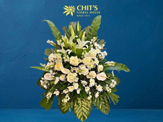 Heavenly Ascent funeral flower arrangement with white lilies and anthuriums