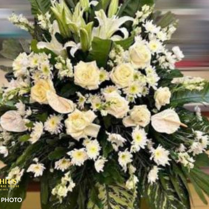 Funeral spray arrangement with white flowers for sympathy in the Philippines