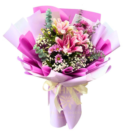 Lavender Lily Luxe bouquet with lily and colorful mums