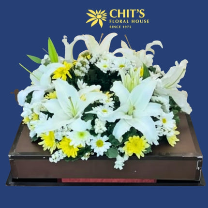 Lily’s Lasting Light urn floral arrangement with white lilies and mums