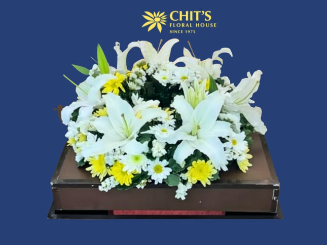 Lily’s Lasting Light urn floral arrangement with white lilies and mums