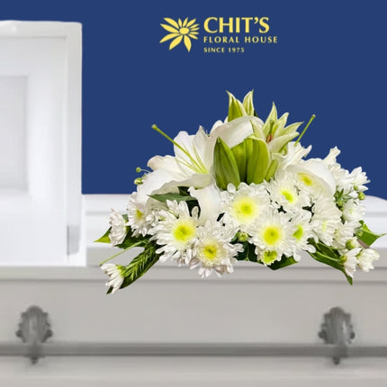 Lily’s Pure Embrace casket flower arrangement with white lilies and chrysanthemums by Chits Floral House Philippines