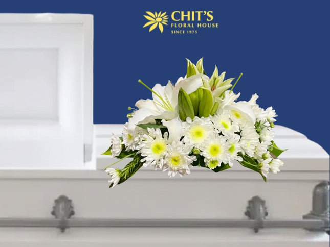 Lily’s Pure Embrace casket flower arrangement with white lilies and chrysanthemums by Chits Floral House Philippines