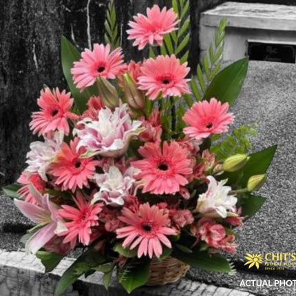 Funeral flower basket with white and pink blooms for sympathy