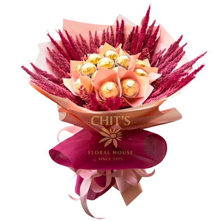 Ferrero Rocher bouquet with dried trigo in magenta theme