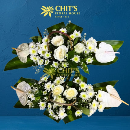 Mass offertory altar flower pair with white roses and anthuriums