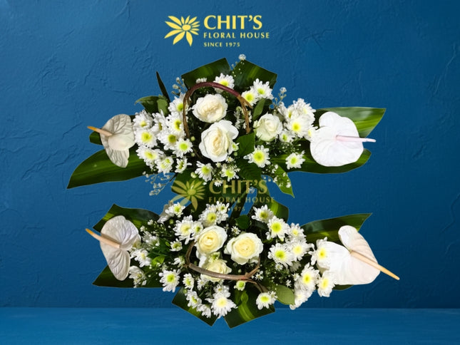 Mass offertory altar flower pair with white roses and anthuriums