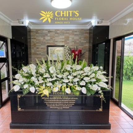 Mausoleum crypt floral garden with white orchids and azucenas