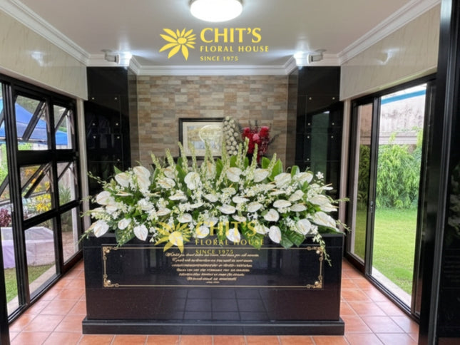 Mausoleum crypt floral garden with white orchids and azucenas