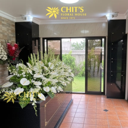 Elegant mausoleum top flower arrangement with white blooms