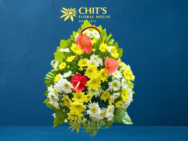 Large Undas floral basket with pink anthuriums and colorful chrysanthemums for cemetery visits