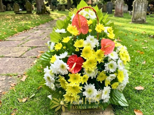 Large Undas floral basket with pink anthuriums and colorful chrysanthemums for cemetery visits