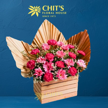 Pink carnation and gerbera Undas memorial flower arrangement in a decorative wooden box