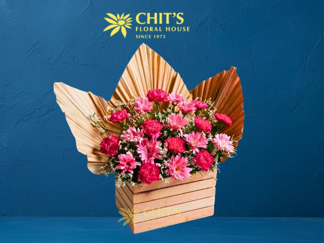 Pink carnation and gerbera Undas memorial flower arrangement in a decorative wooden box
