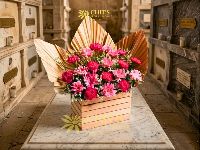 Pink carnation and gerbera Undas memorial flower arrangement in a decorative wooden box