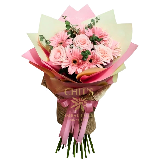 “Pink Garden Medley bouquet with pink roses, gerbera daisies, and eucalyptus greens