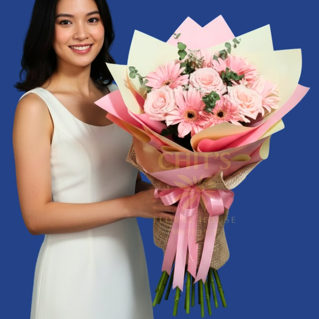 Elegant pink rose and gerbera flower arrangement for special occasions