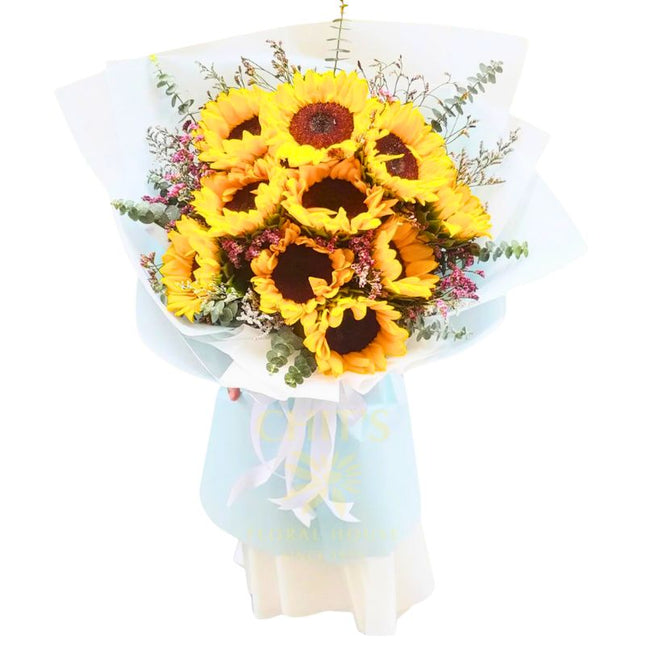 Pure Radiance 10-stem sunflower bouquet with imported accents