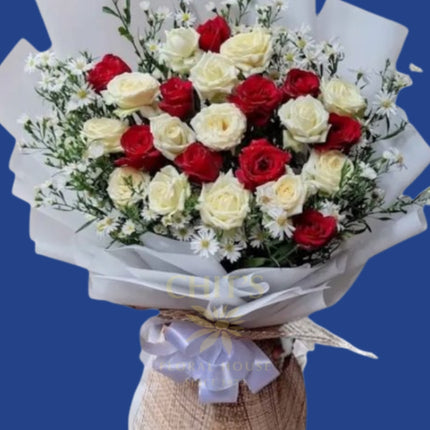 Elegant hand-arranged red and white roses bouquet