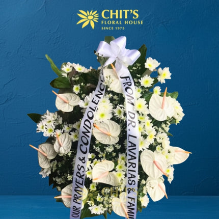 Serene Condolence funeral flower basket with white anthuriums and greens