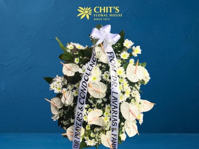 Serene Condolence funeral flower basket with white anthuriums and greens