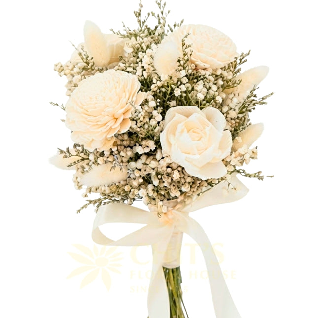 Hand-tied sola flower wedding bouquet with dried accents