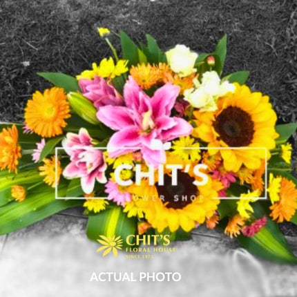 Sunflower and Pink Lily Memorial Lawn Floral Spray
