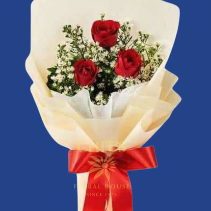 Three Little Words bouquet with three red roses and baby’s breath