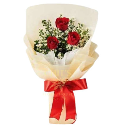 Three Little Words bouquet with three red roses and baby’s breath