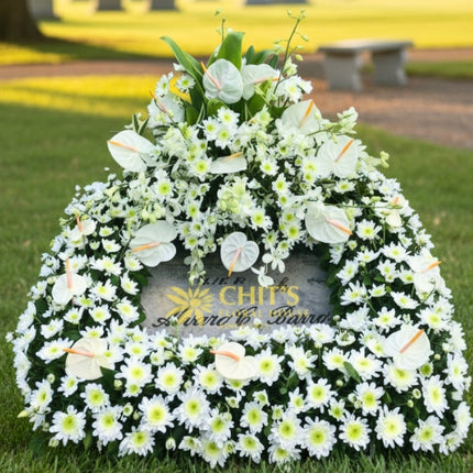 White mums and anthurium funeral lawn spray arrangement