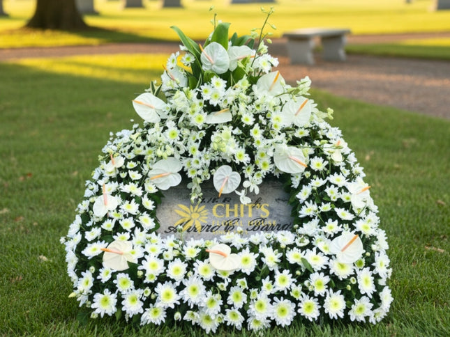 White mums and anthurium funeral lawn spray arrangement