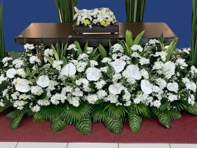 White lilies and yellow mums urn flower arrangement