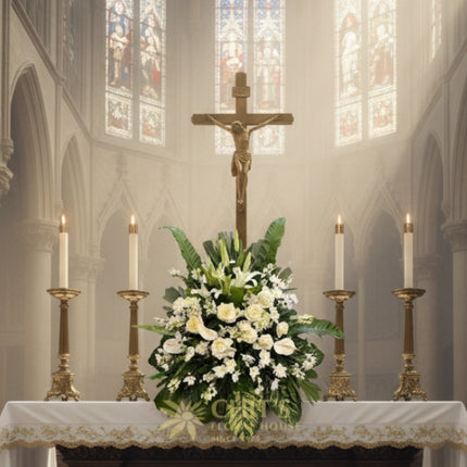 Close-up of white lily, anthurium, and rose sympathy flowers
