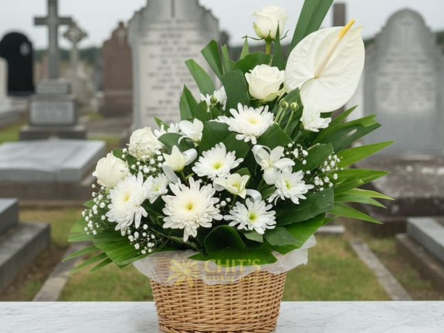 White lily funeral flower basket in a clay pot