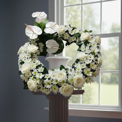 White roses, anthurium, and mums urn flower design