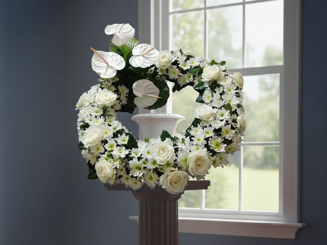 White roses, anthurium, and mums urn flower design